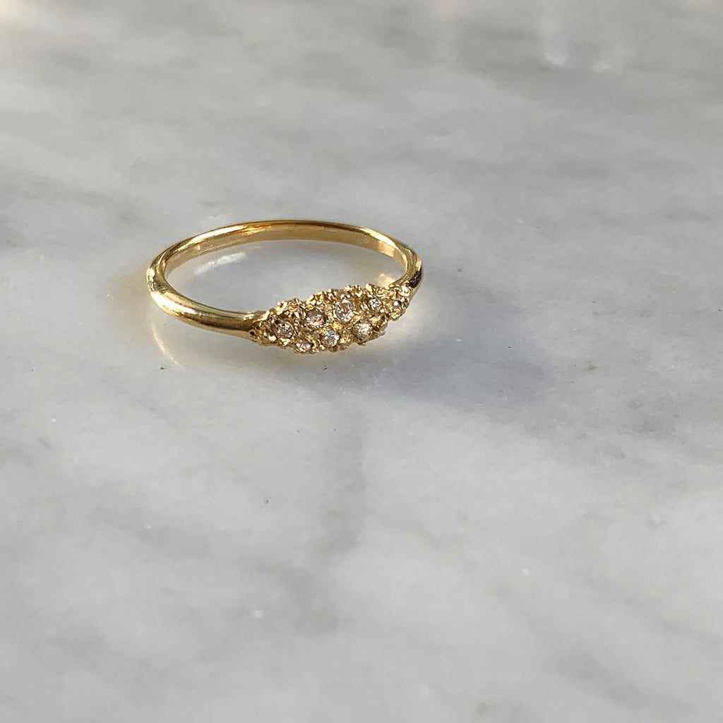 textured, lacy, marquise-shaped component on polished band; shown in 14k yellow with 8 white diamonds