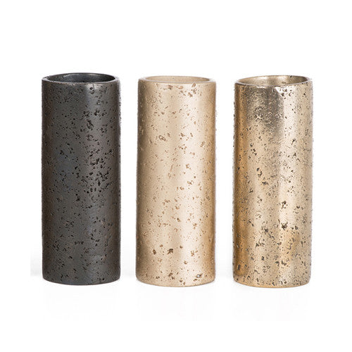 Small, cylindrical vessels with texture resembling rock; shown in satin, polished, and blackened bronze