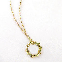 Branch-like necklace in round shape; organic and asymmetrical; shown in polished yellow gold